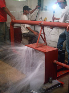 Testing micro-hydroelectric setup at Nueva Alianza, Guatemala