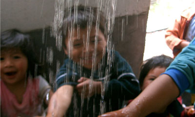 Kids testing hot water